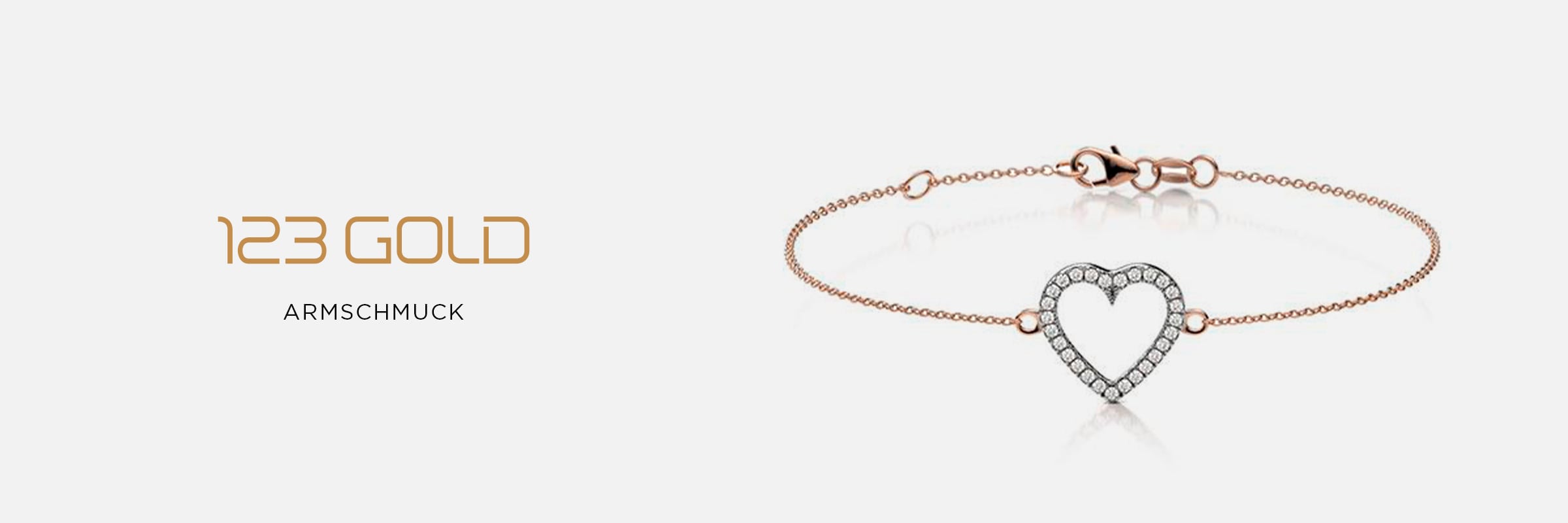 2025 © 123GOLD Ein zartes Armband aus Roségold mit einem diamantbesetzten Herzanhänger ist auf weißem Hintergrund abgebildet. Der Text "123GOLD Armschmuck" erscheint auf der linken Seite und hebt dieses elegante Accessoire hervor.