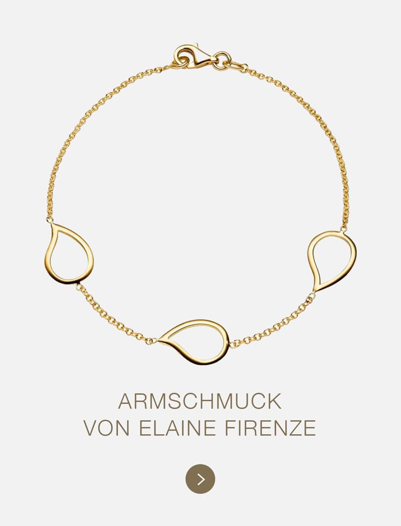 Ein zartes Goldarmband von Elaine Firenze mit drei tropfenförmigen, offenen Anhängern an einer feinen Kette auf hellem Grund. Der Text darunter lautet "ARMSCHMUCK VON ELAINE FIRENZE.